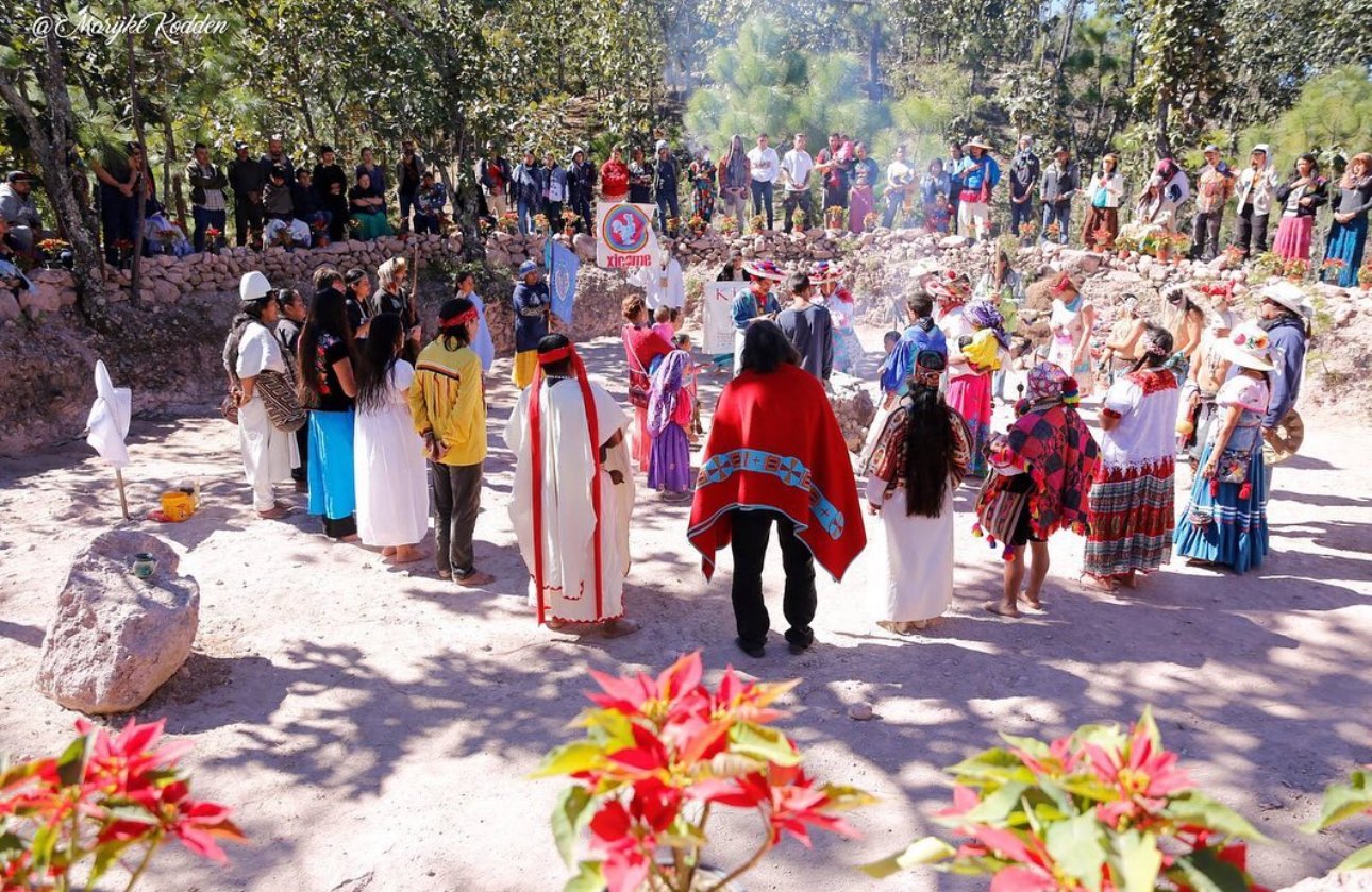 People gathered in a circle at a Kiva gathering. Photograph by Marijke Kodden.